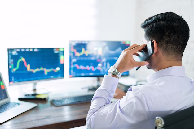 Trader reviewing forex charts